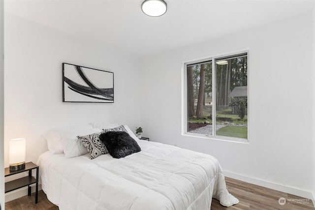 bedroom with wood-type flooring