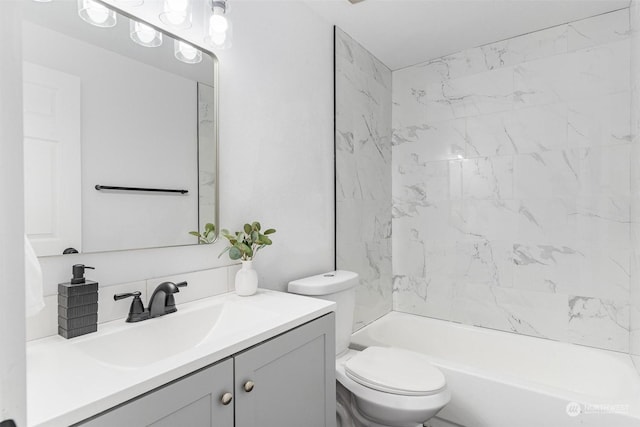 full bathroom with vanity, toilet, and tiled shower / bath combo