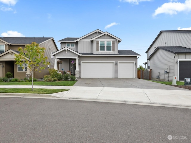 craftsman house featuring an attached garage, board and batten siding, and concrete driveway