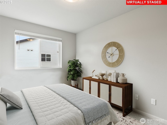 bedroom featuring baseboards