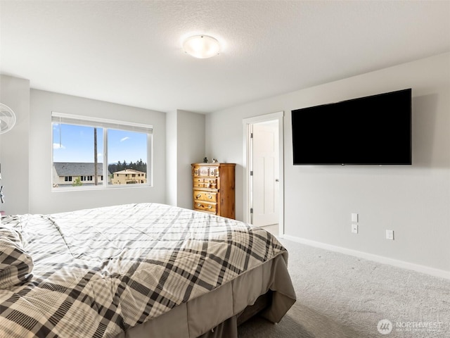 carpeted bedroom with baseboards