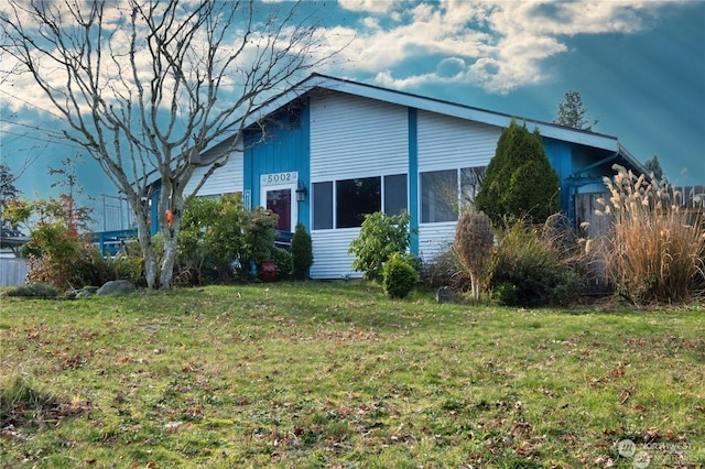 view of property exterior featuring a yard