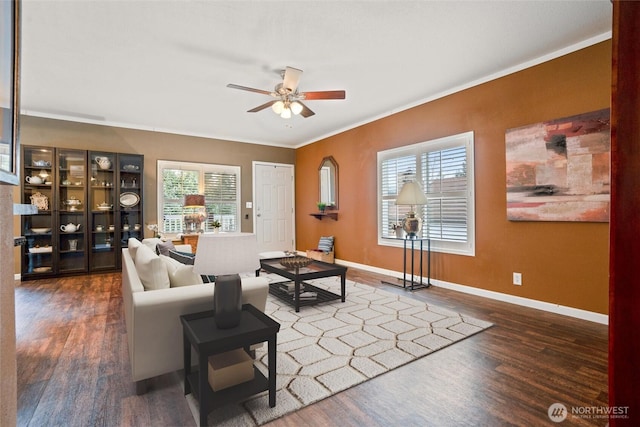 living room featuring crown molding, ceiling fan, and dark hardwood / wood-style floors