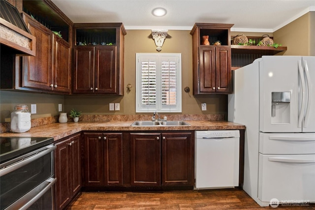 kitchen with sink, dark brown cabinets, dark hardwood / wood-style flooring, custom range hood, and white appliances