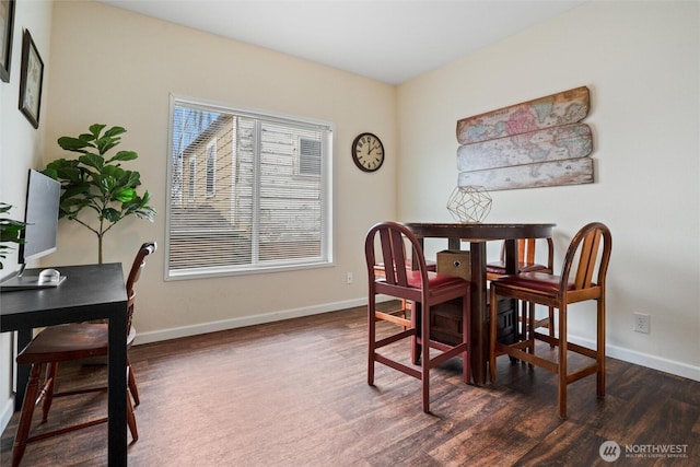 dining area featuring dark hardwood / wood-style flooring