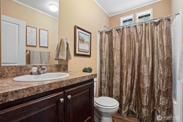 bathroom with hardwood / wood-style flooring, ornamental molding, vanity, and toilet