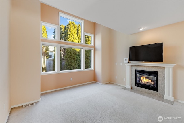 unfurnished living room featuring light colored carpet