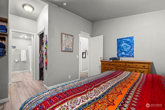 bedroom with light wood-type flooring