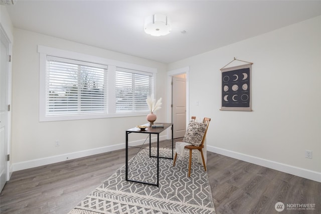 office area featuring baseboards and wood finished floors