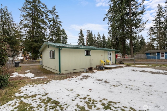 view of snow covered house