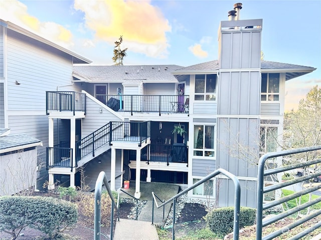 rear view of house featuring a balcony