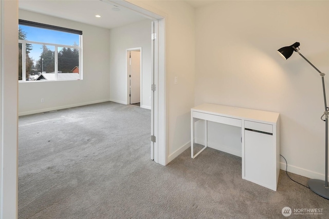 interior space featuring recessed lighting, baseboards, and light colored carpet