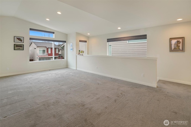 unfurnished room with vaulted ceiling, carpet floors, recessed lighting, and baseboards