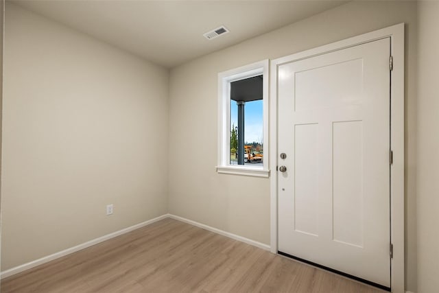 doorway to outside with light hardwood / wood-style flooring