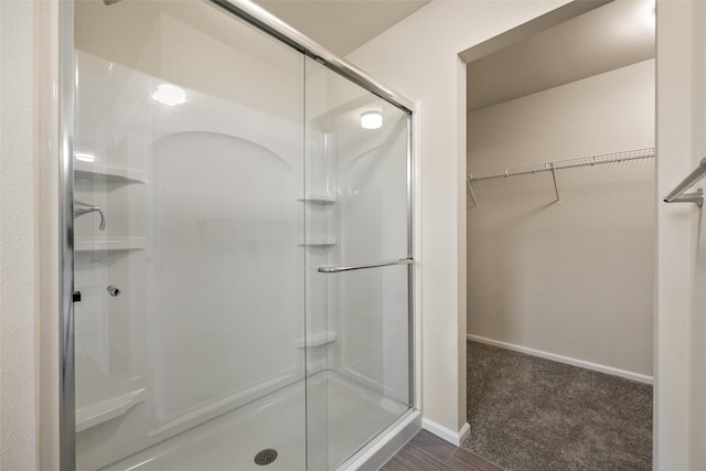 bathroom with a shower with shower door