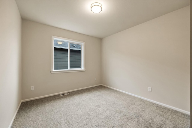 spare room featuring carpet flooring