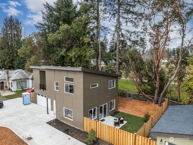 exterior space with a garage and a patio area