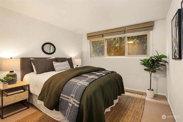 bedroom with light colored carpet