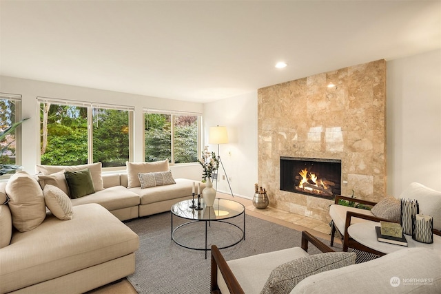 living room with a tile fireplace