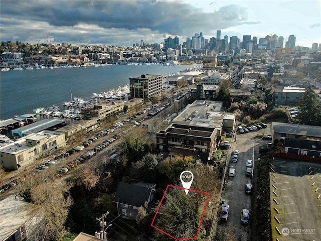 birds eye view of property with a water view