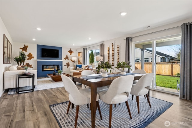 287 Wind River Ct, Chehalis, WA 98532 - dining room with recessed lighting, wood finished floors, and a glass covered fireplace