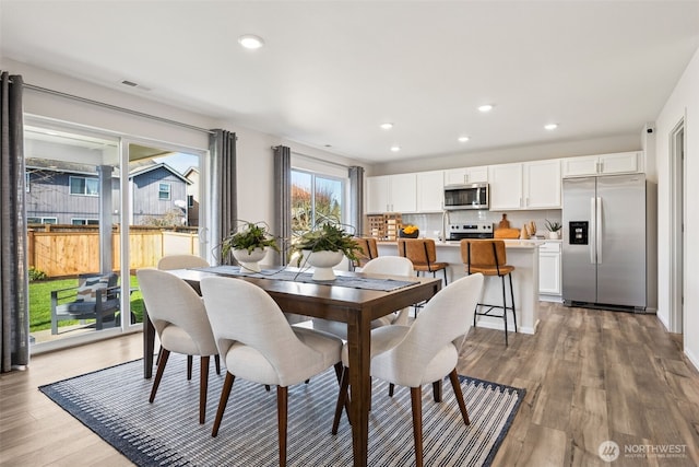 287 Wind River Ct, Chehalis, WA 98532 - dining room with visible vents, light wood-style flooring, and recessed lighting