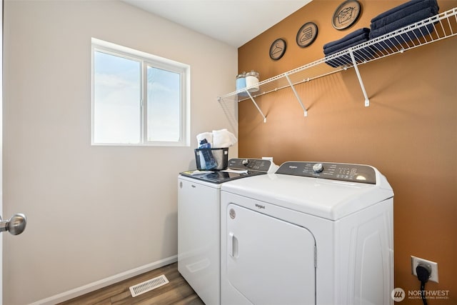 287 Wind River Ct, Chehalis, WA 98532 - clothes washing area with laundry area, wood finished floors, visible vents, baseboards, and washer and clothes dryer