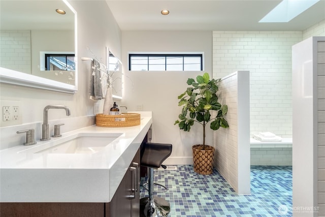 full bathroom featuring recessed lighting and vanity