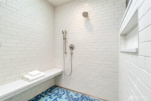 full bathroom with tiled shower