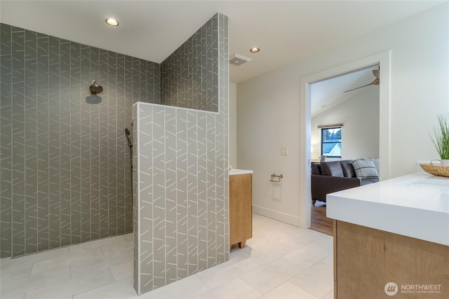 ensuite bathroom featuring recessed lighting, walk in shower, vanity, and ensuite bathroom