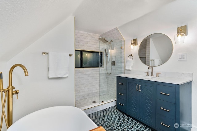 bathroom featuring vanity, plus walk in shower, vaulted ceiling, and a textured ceiling