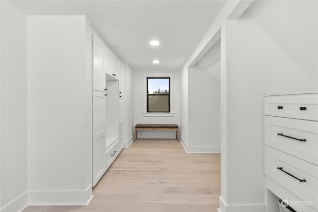 hall with light hardwood / wood-style floors