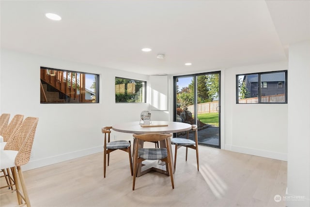 dining room with light hardwood / wood-style flooring