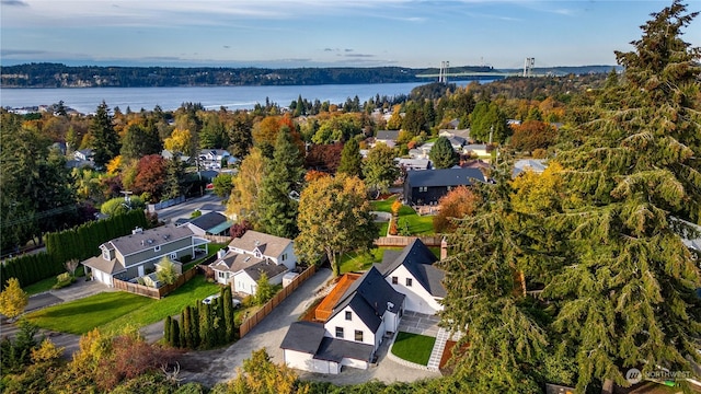 birds eye view of property featuring a water view