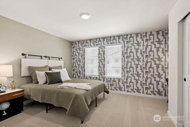 bedroom featuring carpet, baseboards, and wallpapered walls