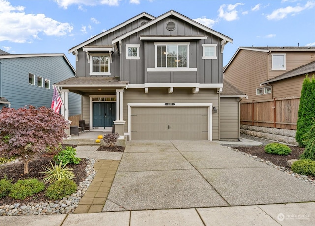 view of front of house featuring a porch and a garage