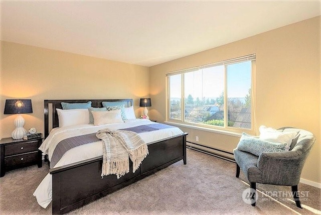 bedroom with light colored carpet and a baseboard heating unit