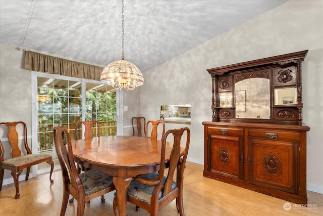 dining space with an inviting chandelier and light wood-type flooring