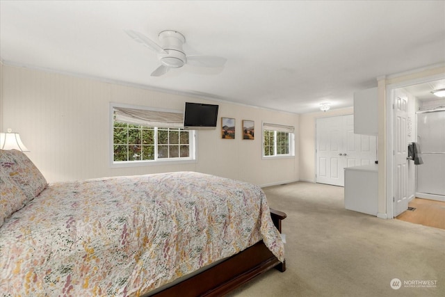 bedroom featuring ceiling fan and light carpet