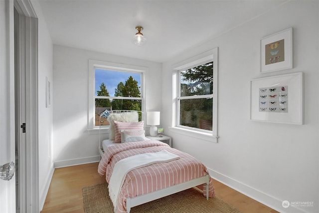 bedroom with light wood-type flooring