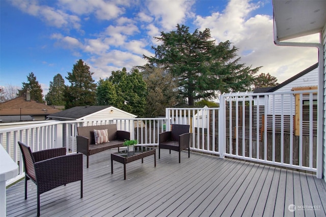 wooden deck with an outdoor hangout area