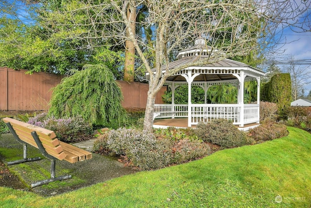 view of yard featuring fence and a gazebo