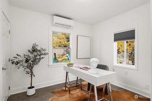 office space featuring dark wood-style flooring, a wall mounted air conditioner, and plenty of natural light