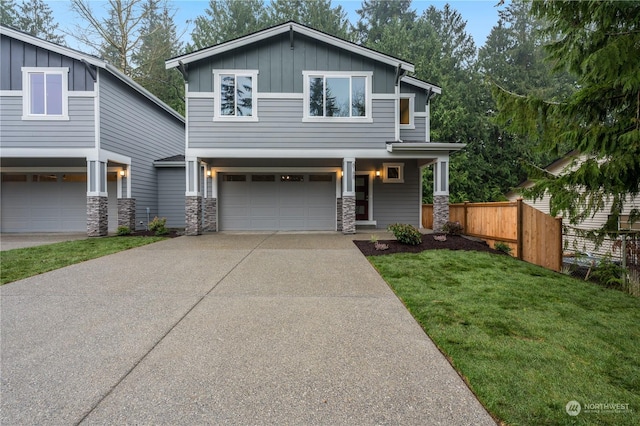 view of front of property featuring a garage and a front lawn