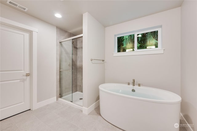 bathroom featuring tile patterned floors and plus walk in shower