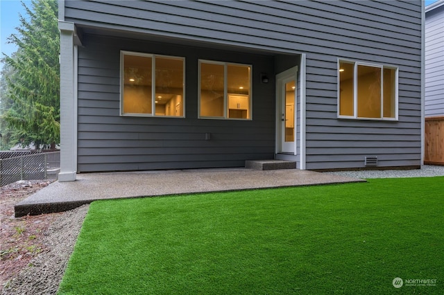 rear view of house with a yard