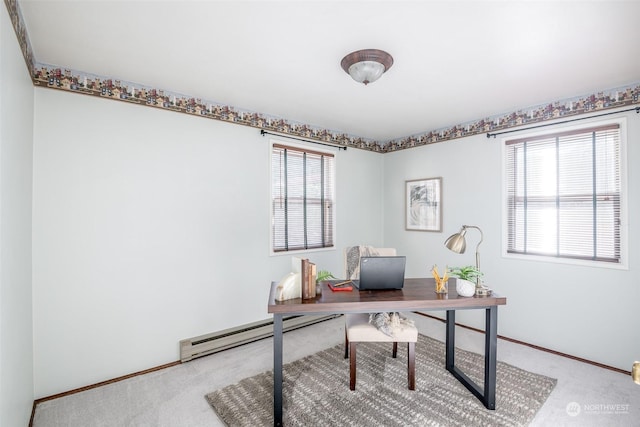 office area with carpet flooring and a baseboard heating unit