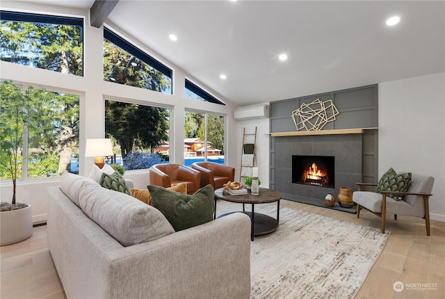 living room with beam ceiling, high vaulted ceiling, a wall unit AC, light hardwood / wood-style floors, and a tiled fireplace