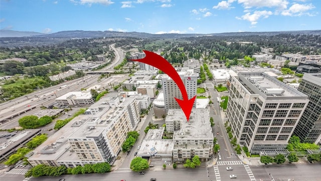 300 110th Ave NE # 611, Bellevue, WA 98004 - birds eye view of property featuring a mountain view and a city view