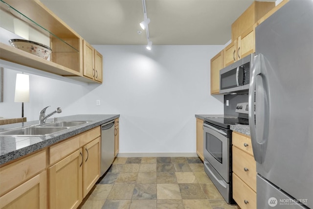 300 110th Ave NE # 611, Bellevue, WA 98004 - kitchen with a sink, stone finish flooring, appliances with stainless steel finishes, and light brown cabinetry